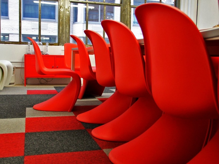the-board-room-is-filled-with-these-funky-red-chairs